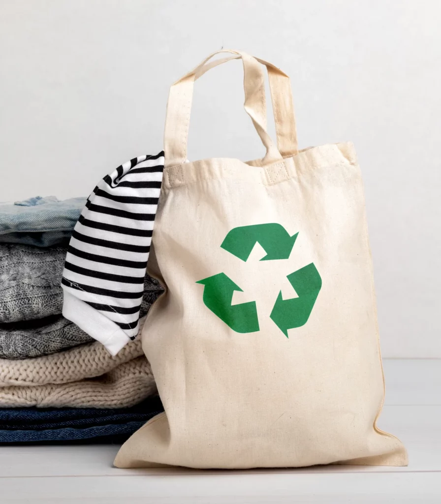 reusable shopping back with a recycling logo on the side